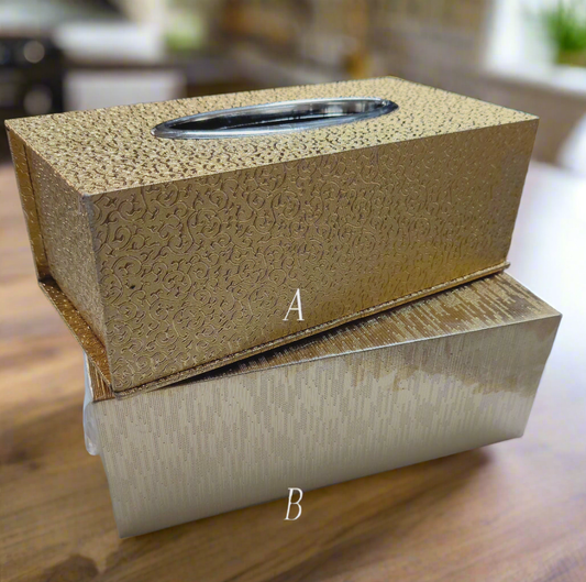 A rectangular decorative tissue box holder in an elegant color with a metallic patterned finish
