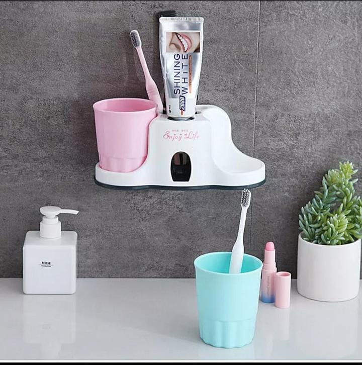 Toothbrush holder with dispenser