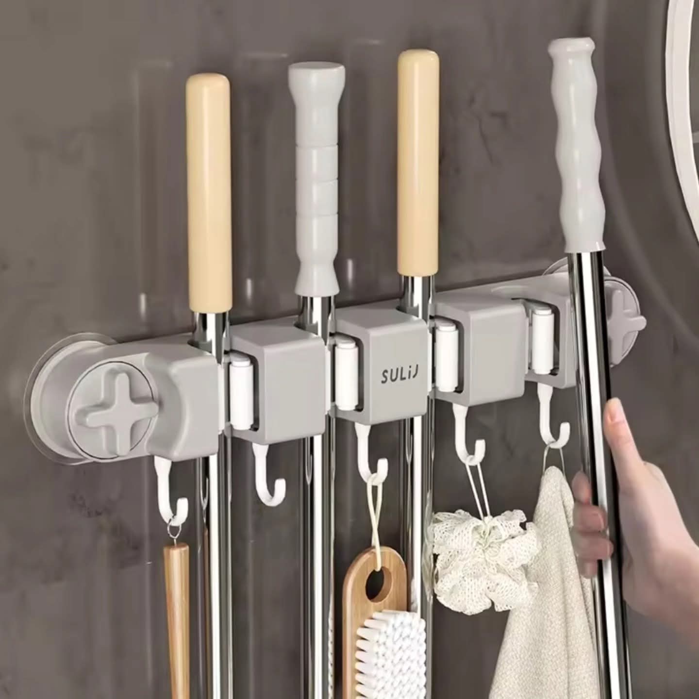 Wall mounted mop holder