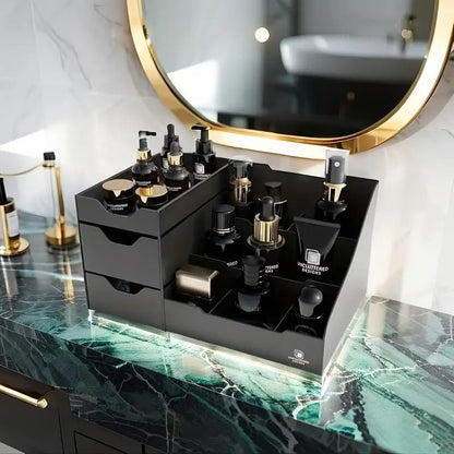 Black desktop organizer with two drawers on the left and multiple open tiered compartments 