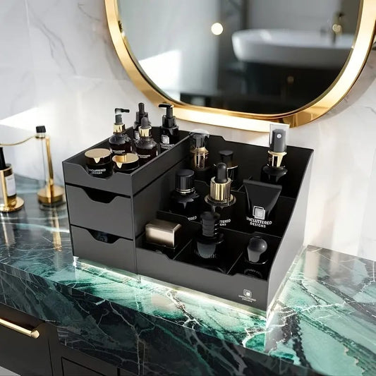 Black desktop organizer with two drawers on the left and multiple open tiered compartments 