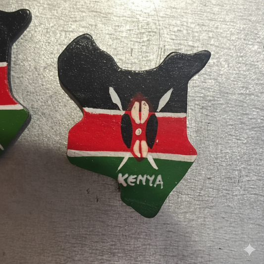 Hand-painted wooden fridge magnet shaped like the map of Kenya with the Kenyan flag colors and shield.