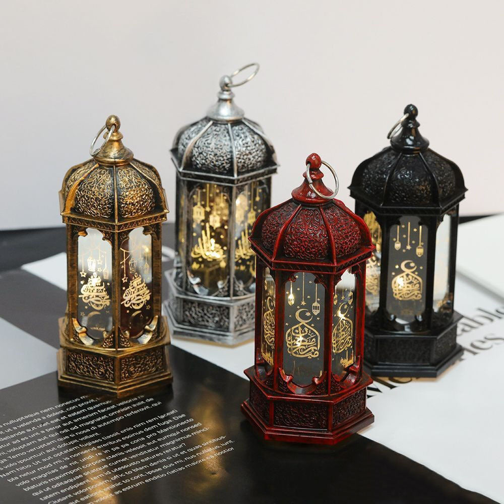 Four ornate lanterns of different colors.