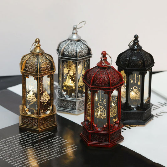 Four ornate lanterns of different colors.