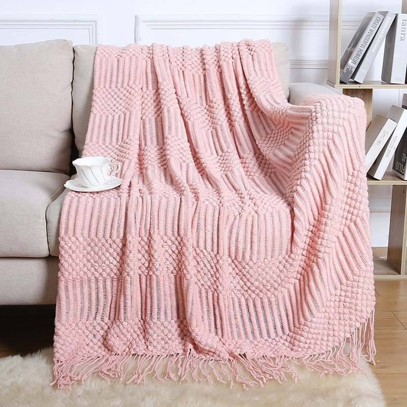 Knitted throw blanket with tassels