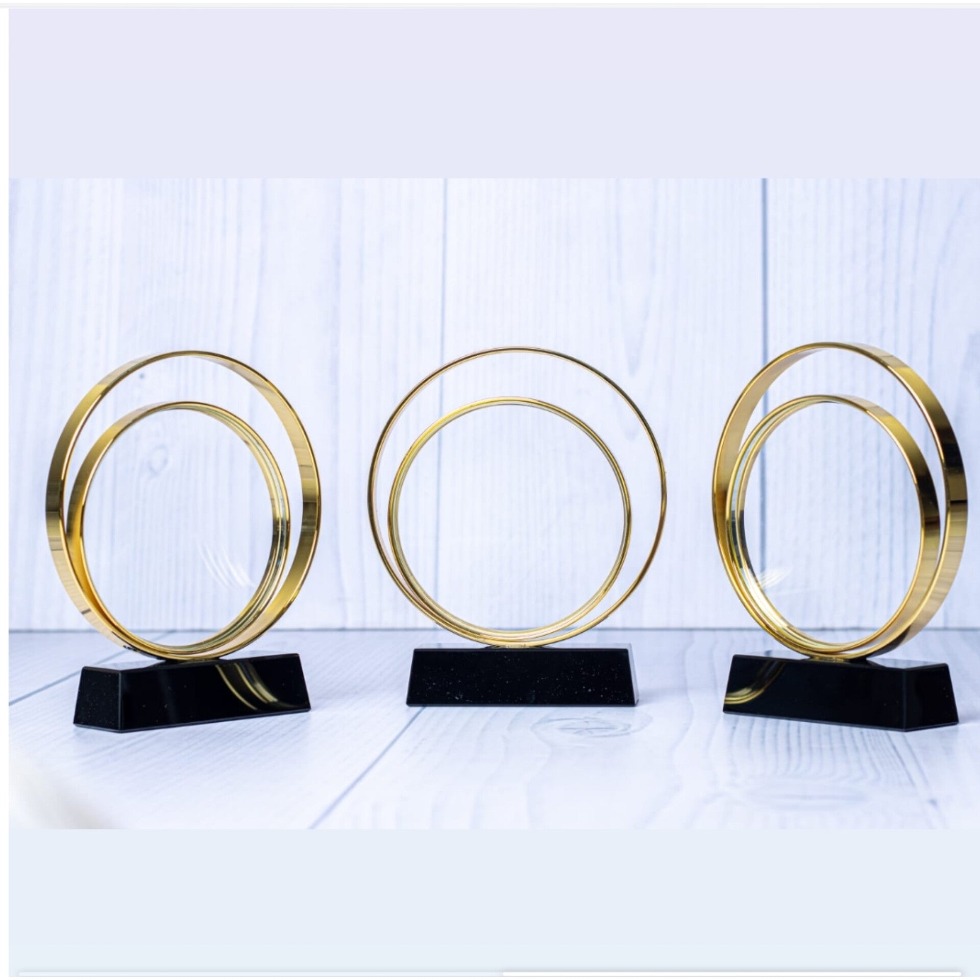 Crystal ring award with gold ring and black stand 