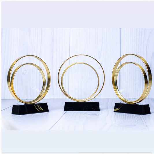 Crystal ring award with gold ring and black stand 