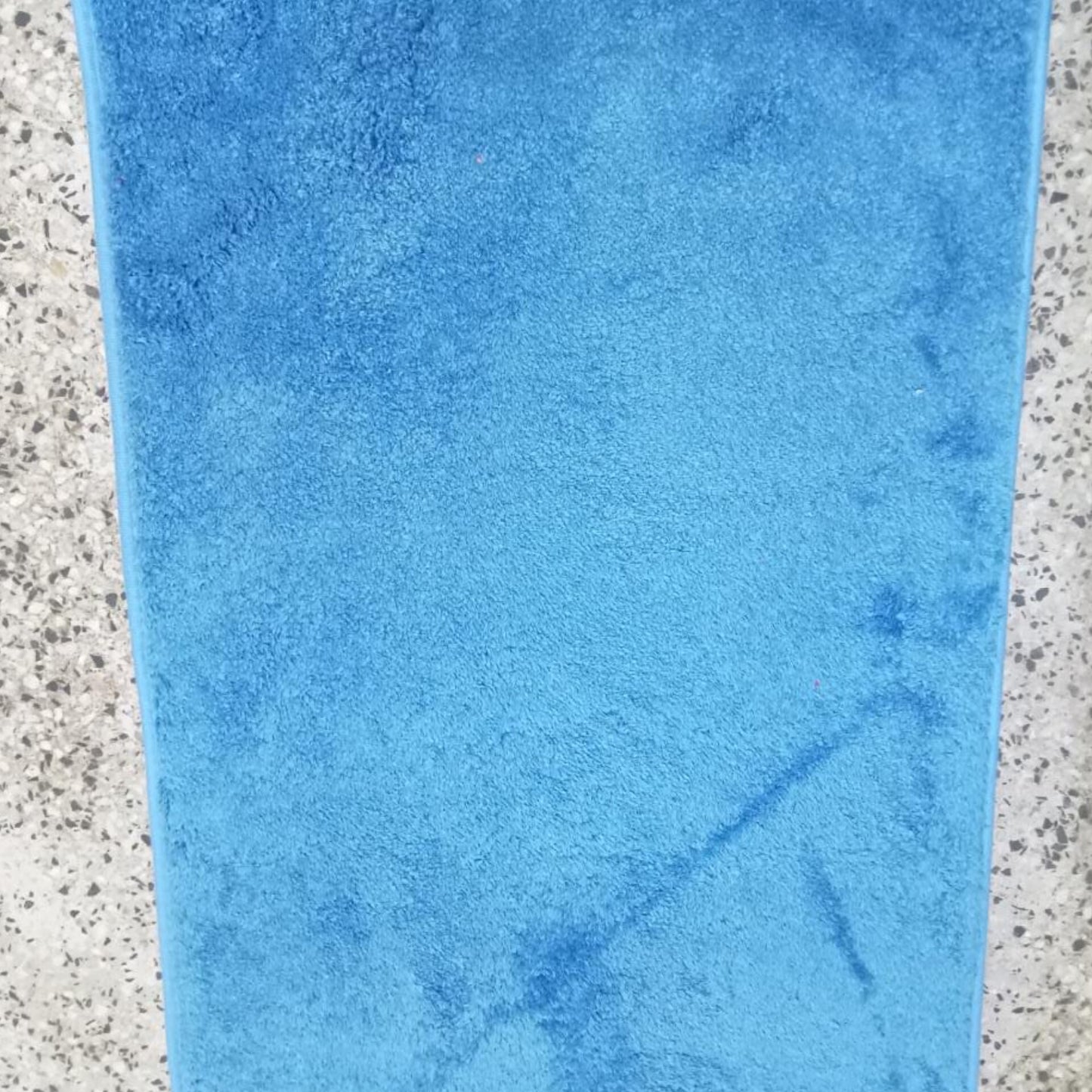 Absorbent bathroom door mat