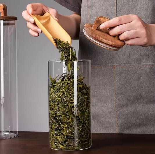 Glass storage jar with wooden lid