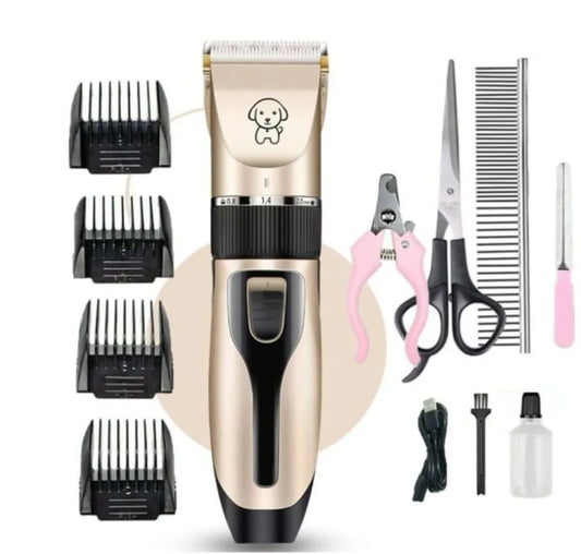 A pet grooming kit including a clipper with multiple attachments, scissors, clippers, and other grooming tools laid out on a white background.