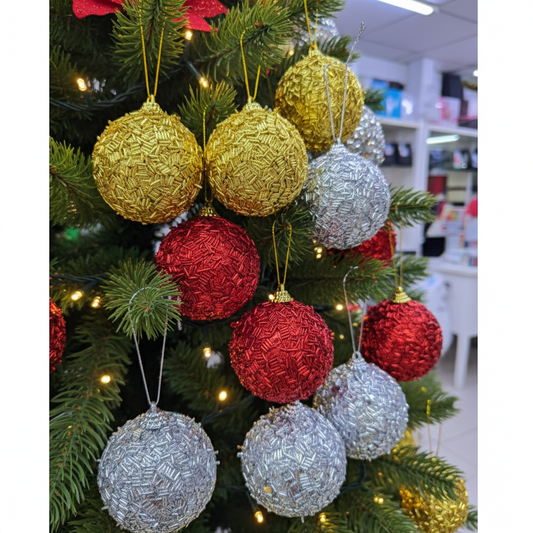 Decorative Christmas tree balls  with gold, red, and silver baubles 