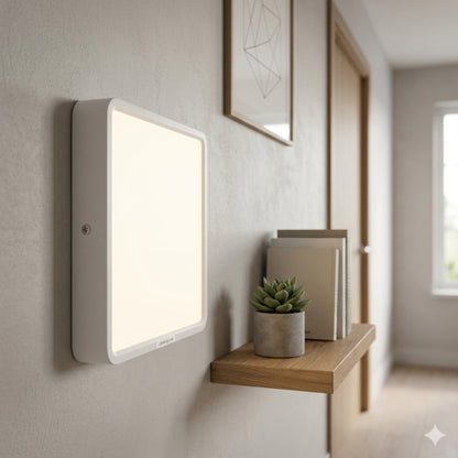 A square white frame surface mounted led downlight fixture.