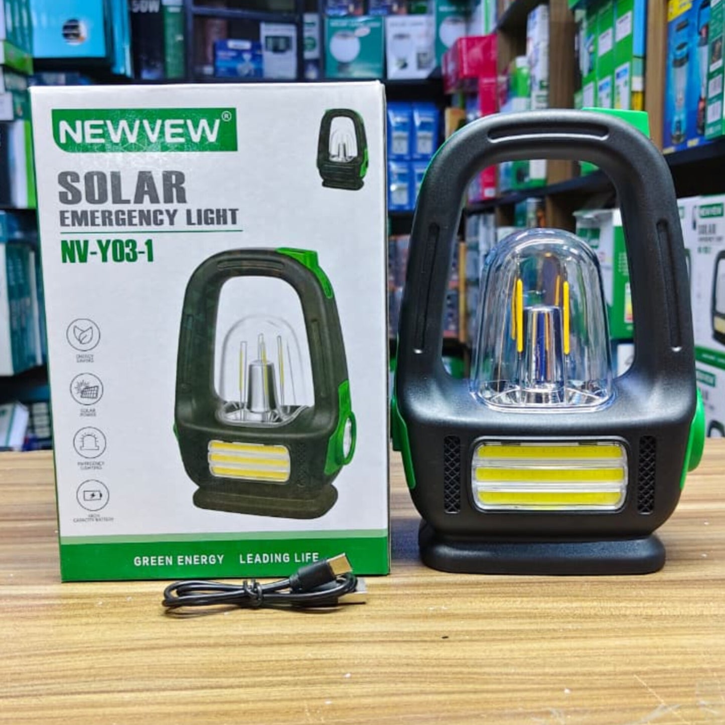 Black and green Newvew solar emergency lantern.