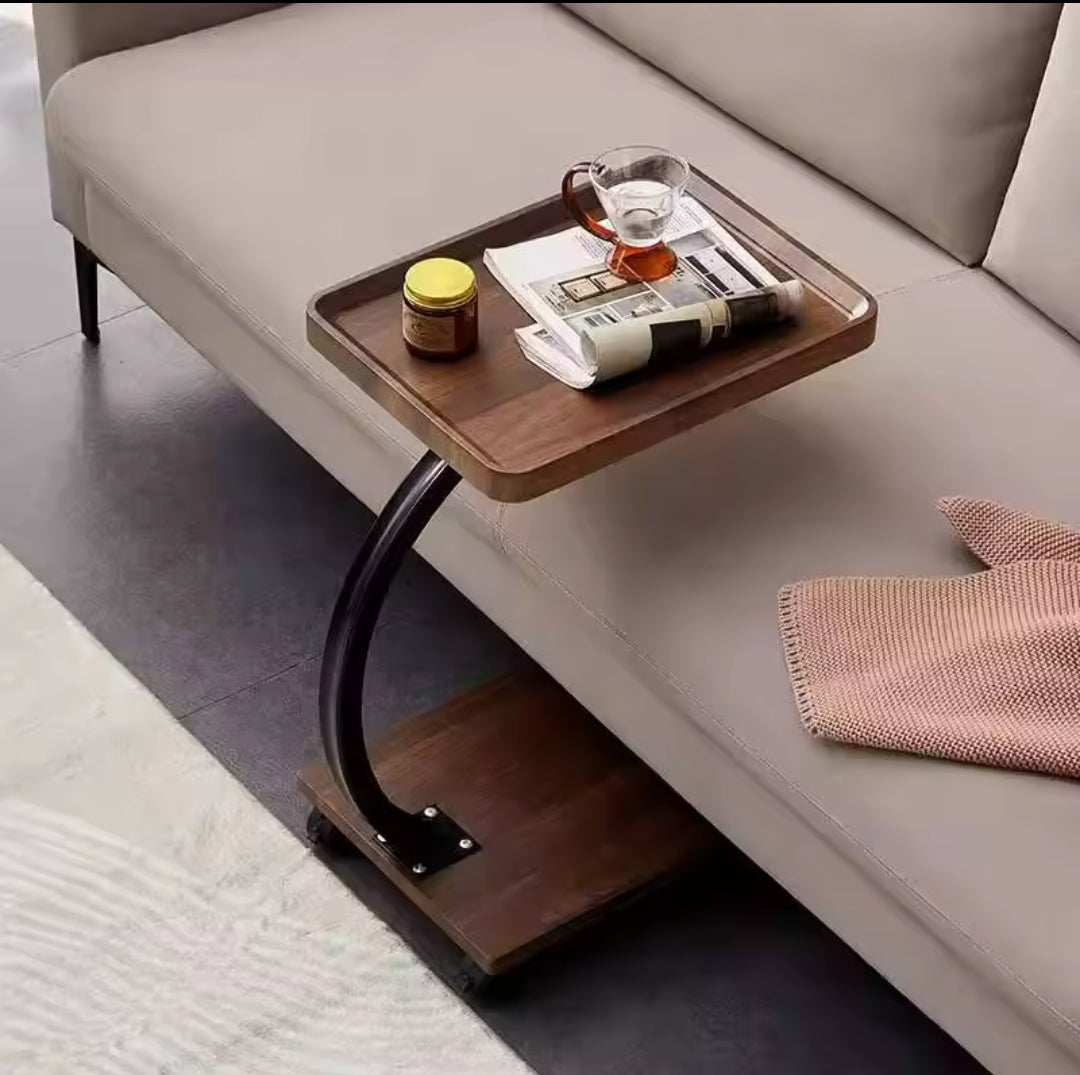 C-shaped side table with wheels