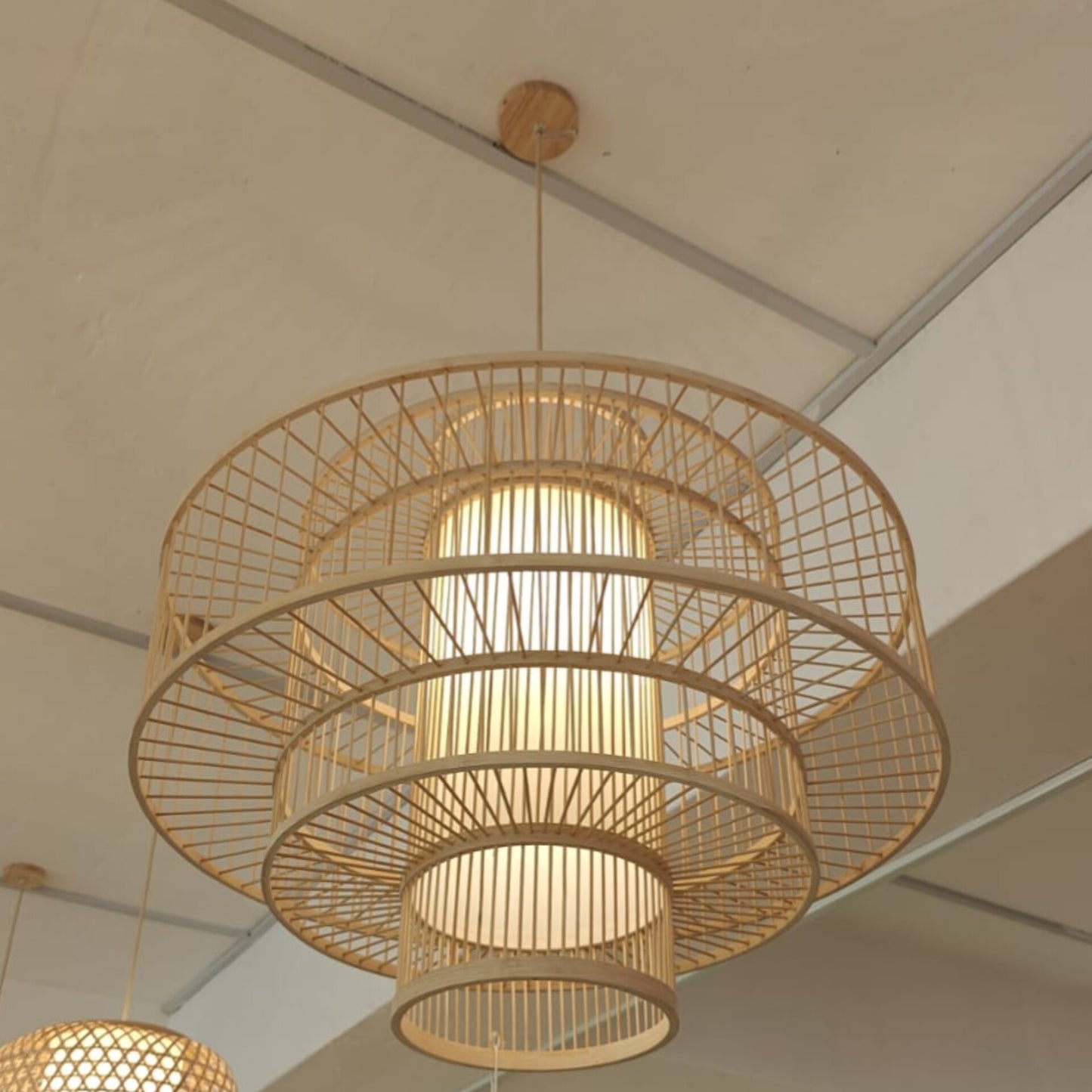 Woven rattan pendant light hanging from the ceiling