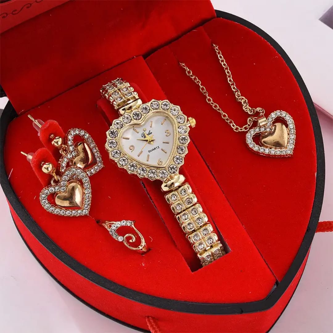 Gold watch and jewelry set in a heart-shaped red box