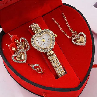 Gold watch and jewelry set in a heart-shaped red box