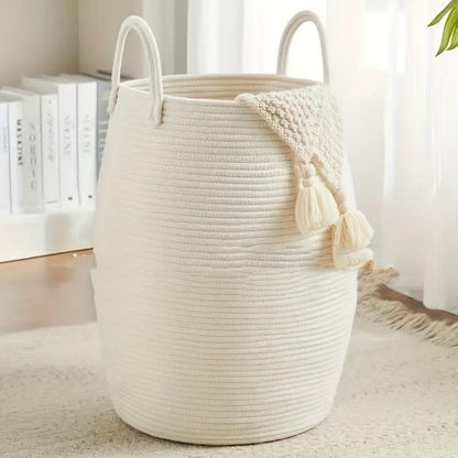 A large woven cotton rope basket with tall handles 