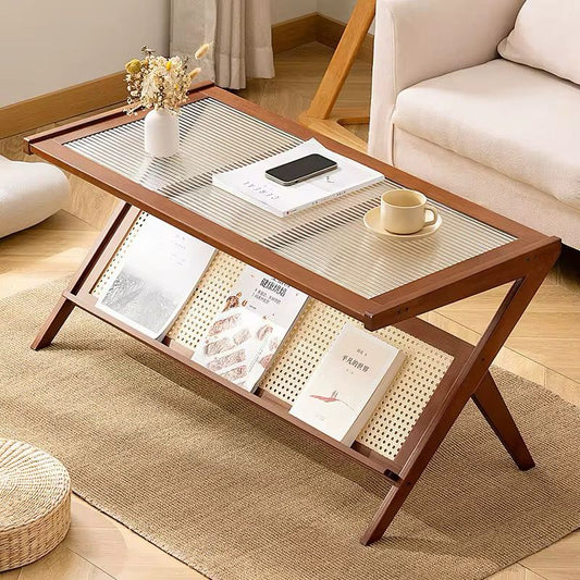 Dark brown wooden coffee table with a rectangular glass top and a rattan storage shelf underneath.