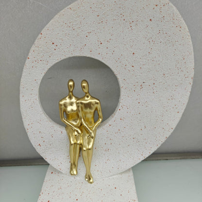 Golden Harmony Figurine with Circular Backdrop