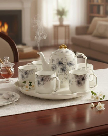 Elegant Porcelain Tea Set with Blossom Motif and Serving Tray
