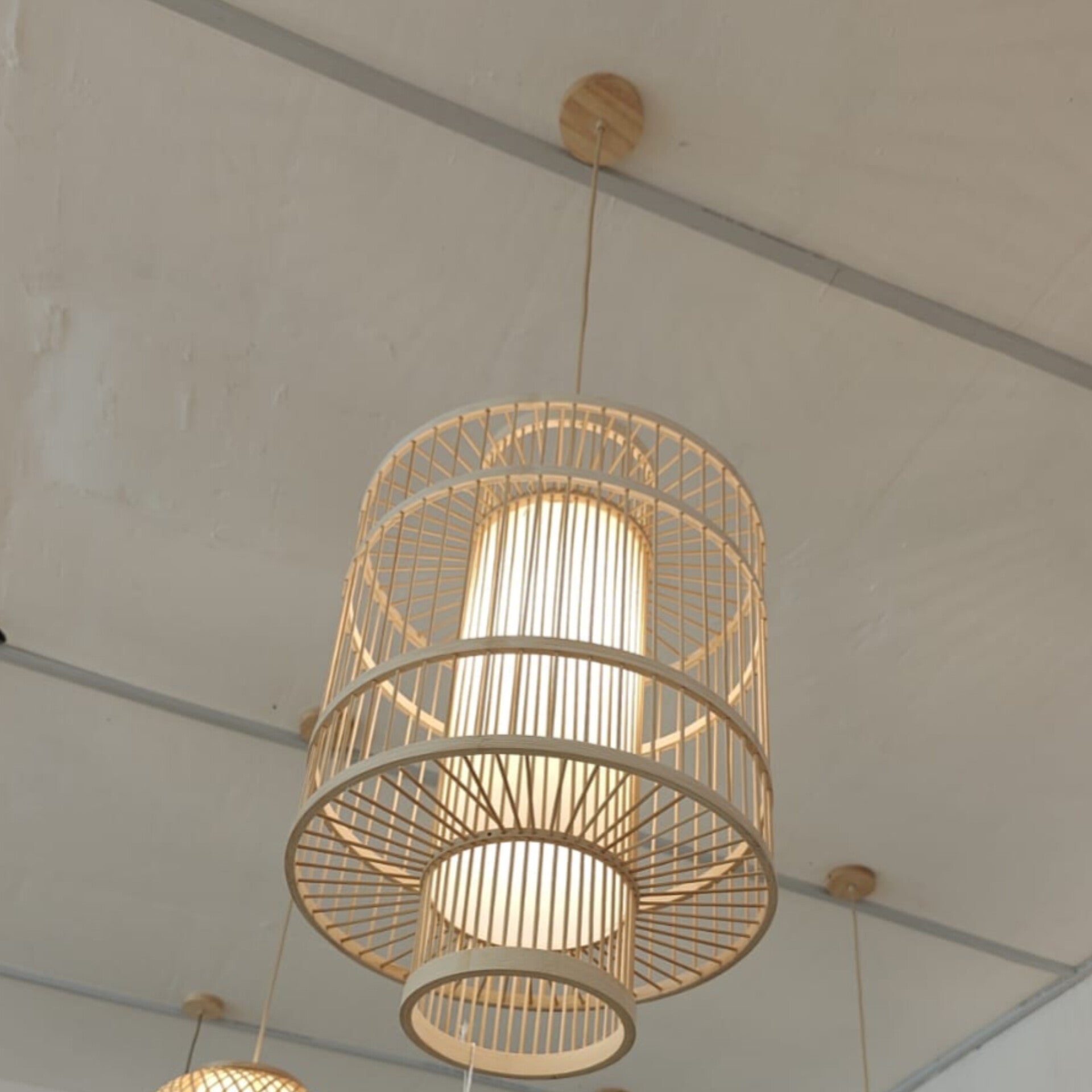 Woven pendant light fixture hanging from a ceiling