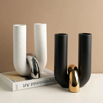 Black and white u shaped ceramic vases with metallic center bridges