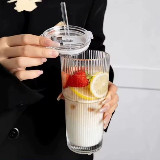 Glass cup with straw
