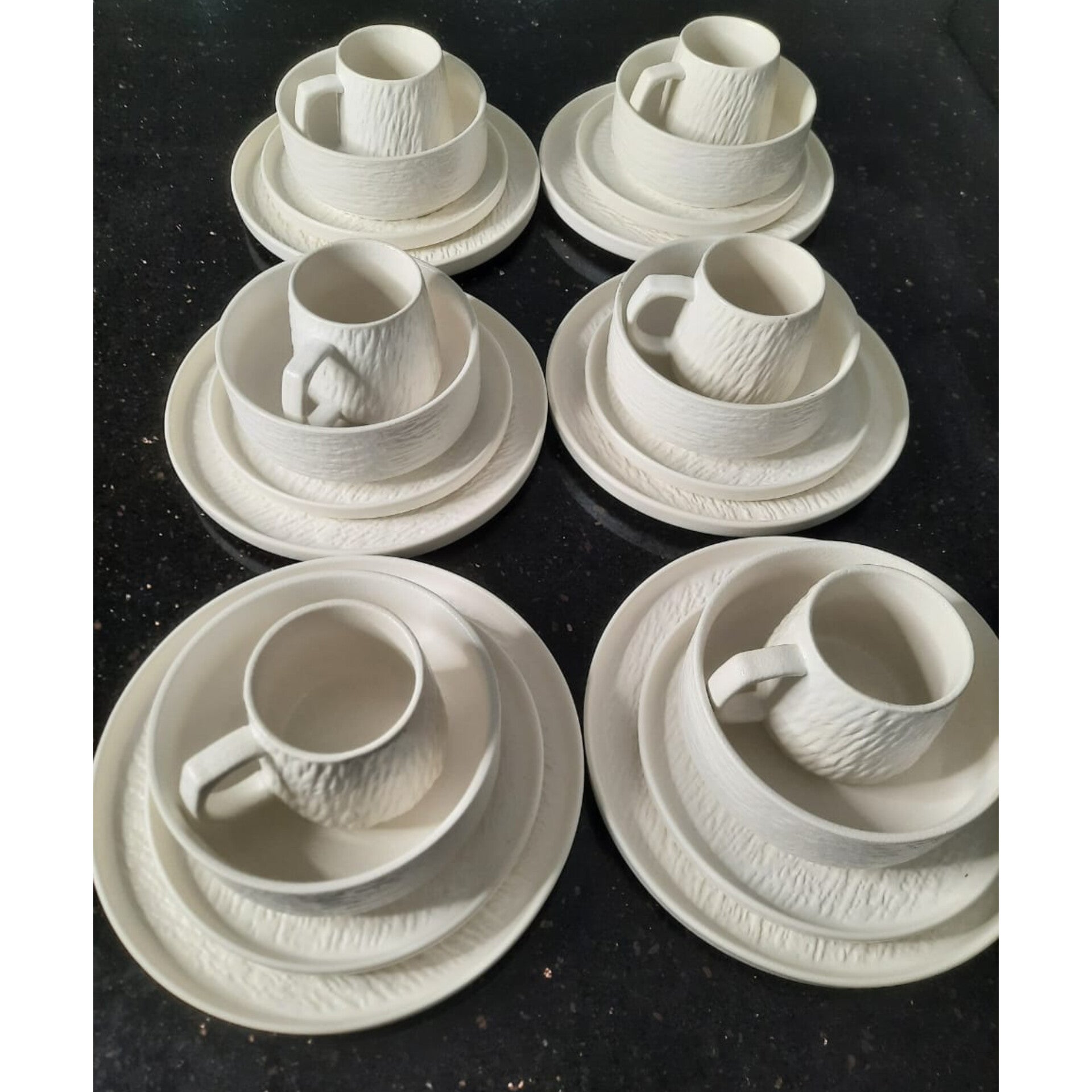 Twenty four piece textured ceramic dinnerware set