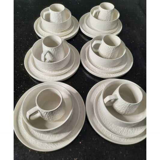 Twenty four piece textured ceramic dinnerware set