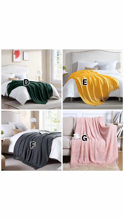 Knitted throw blanket with tassels