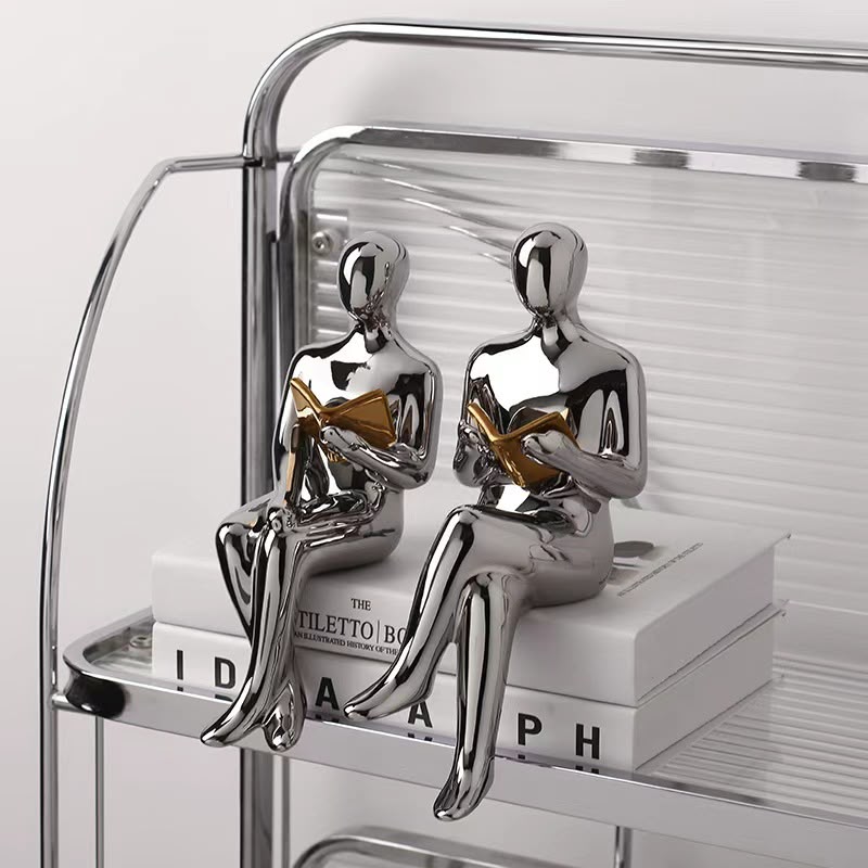 Silver Reader Bookend Sculptures
