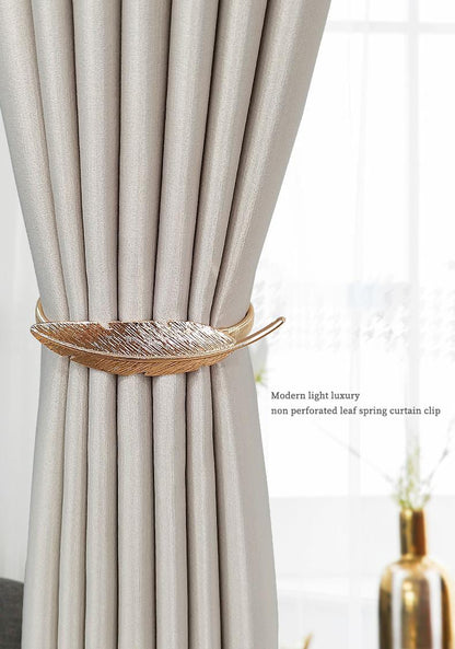Spring curtain tie-back