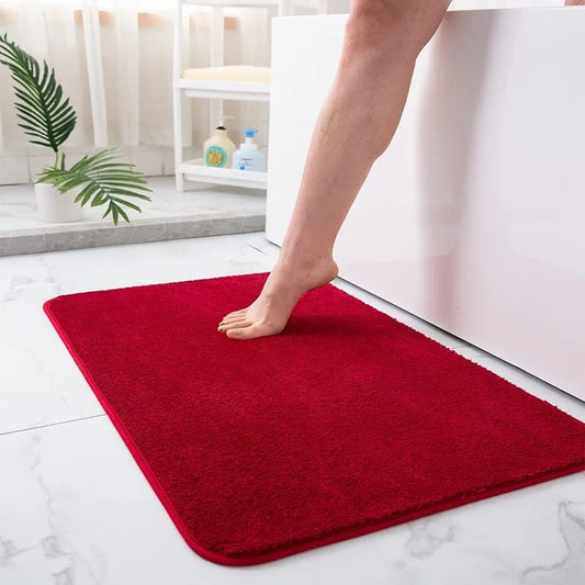 Absorbent bathroom door mat