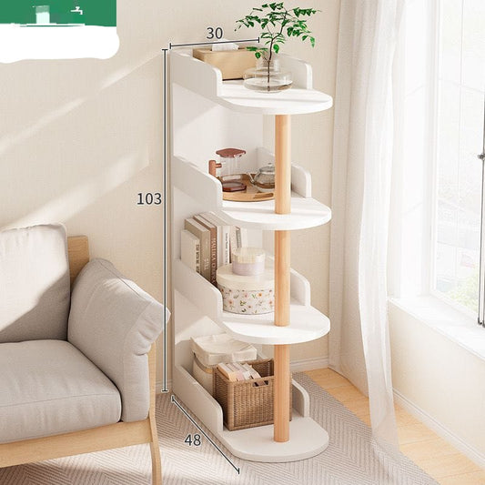 White curved wood bedside table or bookshelf with four tiers and a natural wood center pole.