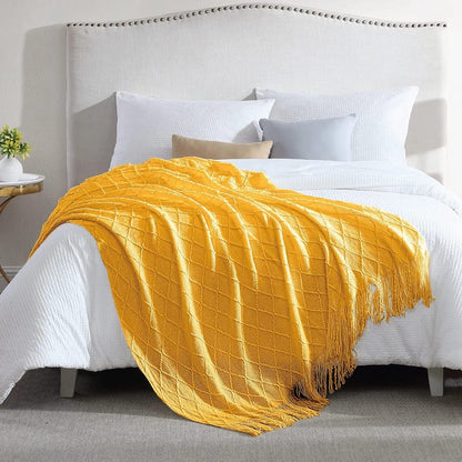 Knitted throw blanket with tassels