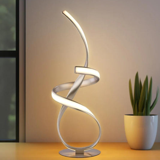 A spiral LED table lamp with a silver metallic frame.