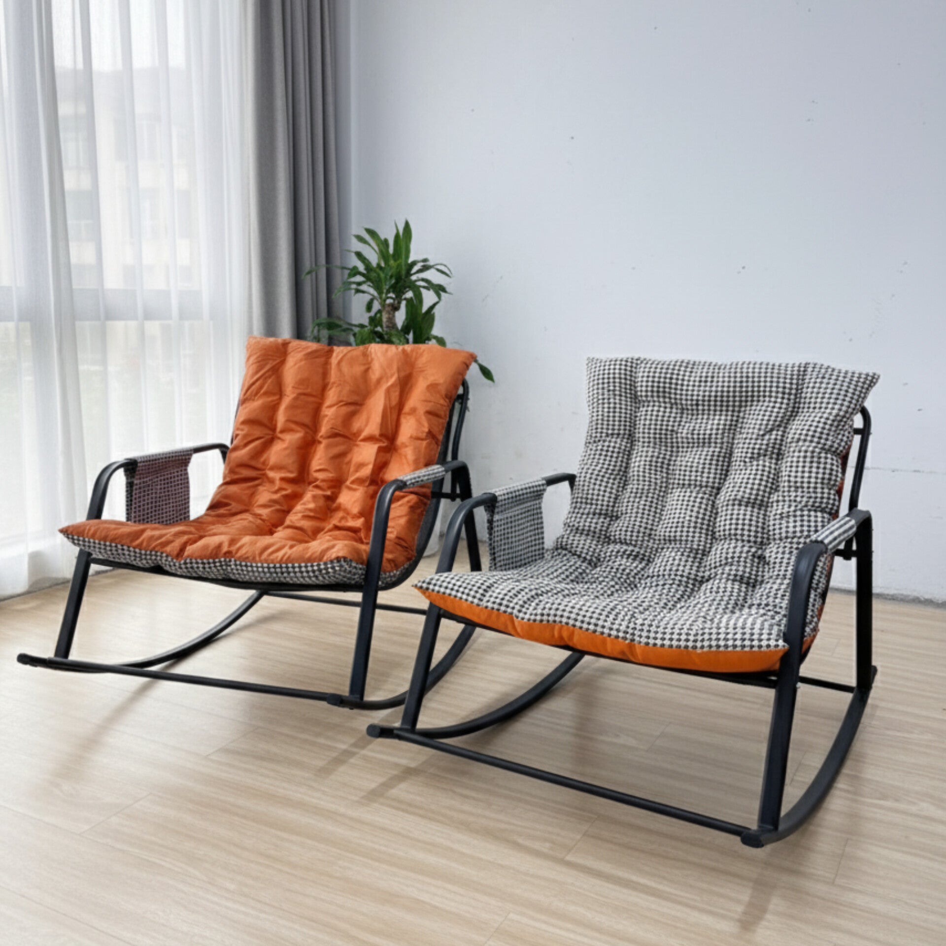 Modern double rocking chair with black metal frame and thick houndstooth cushions
