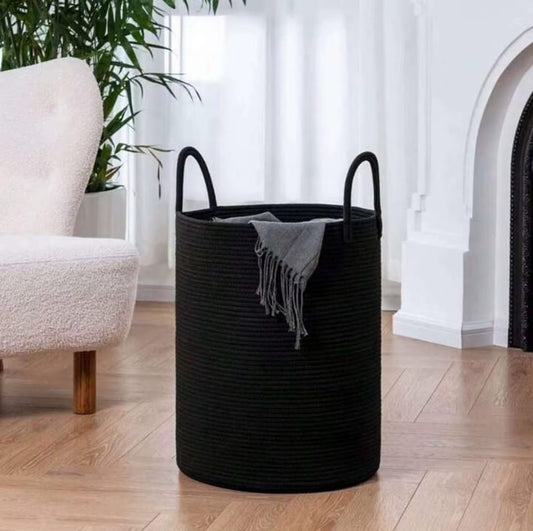 Large, tall black woven cotton rope basket with handles.