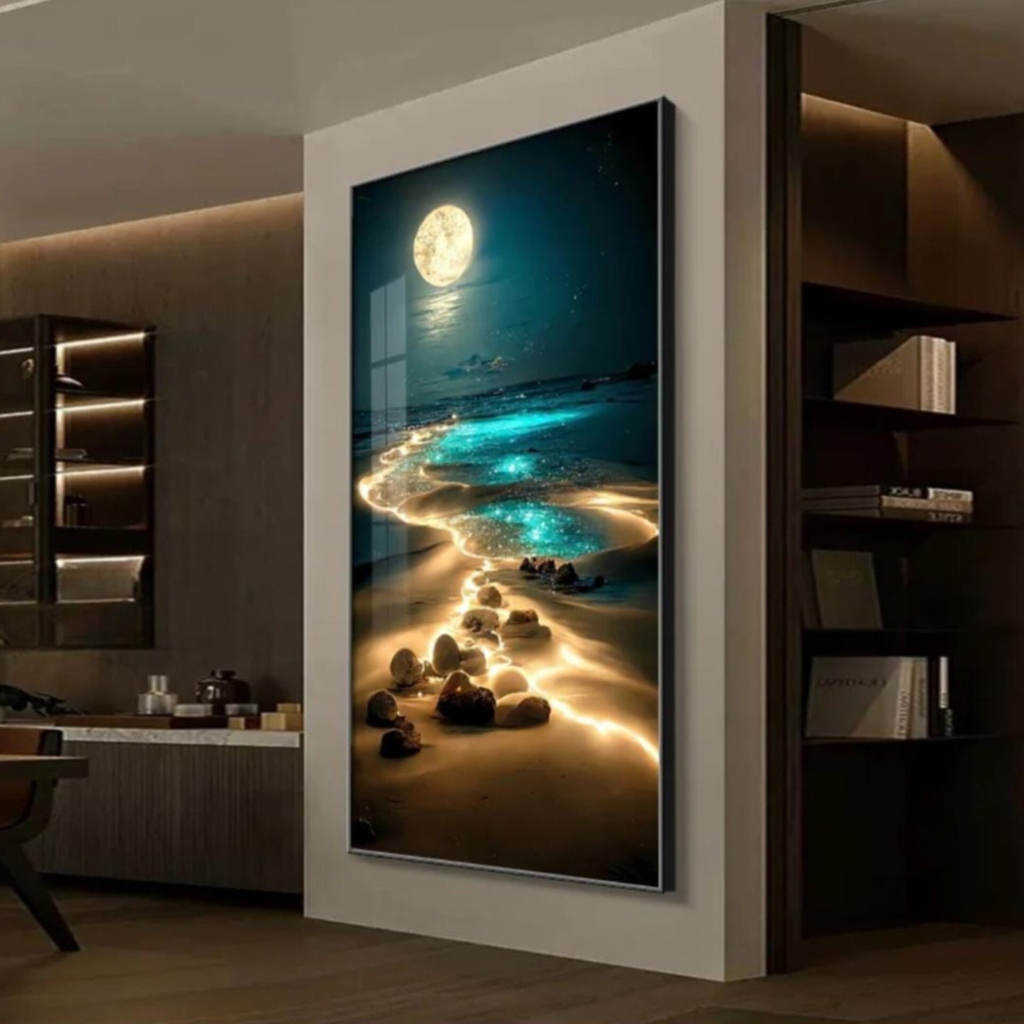 Framed artwork of a beach scene with rocks and a moonlit sky 