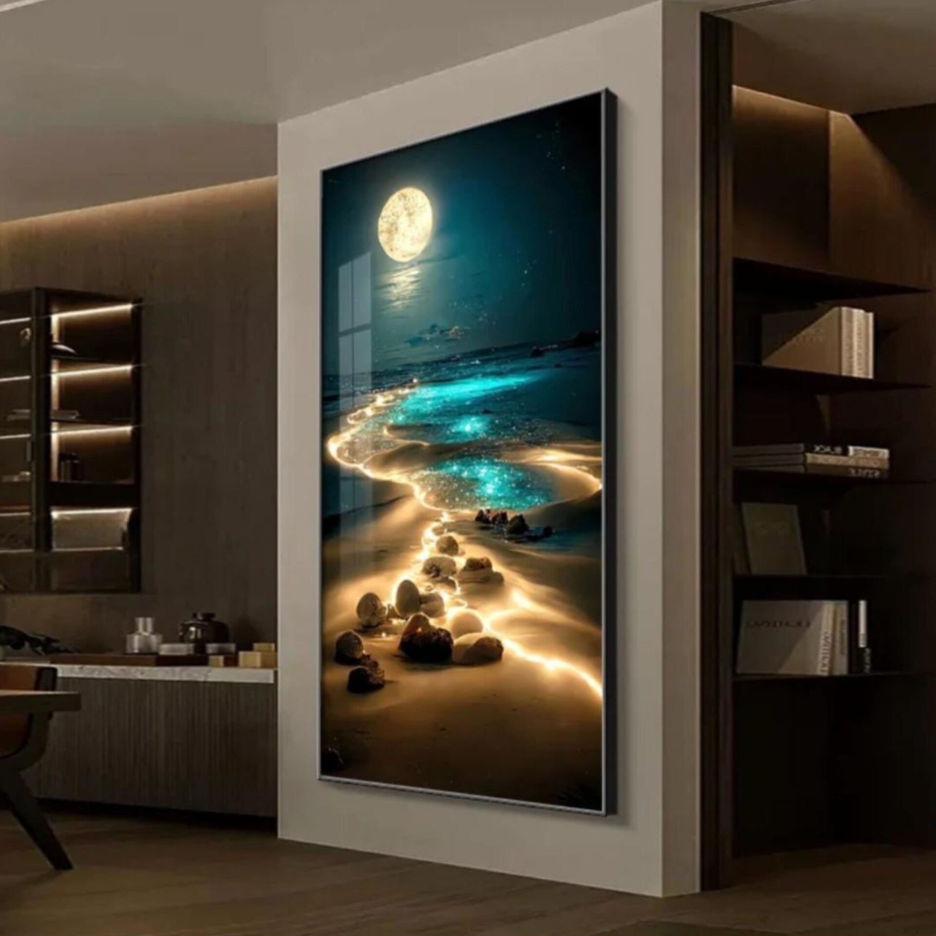Framed artwork of a beach scene with rocks and a moonlit sky 