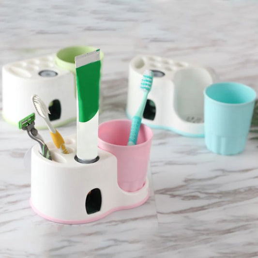 Toothbrush holder with dispenser