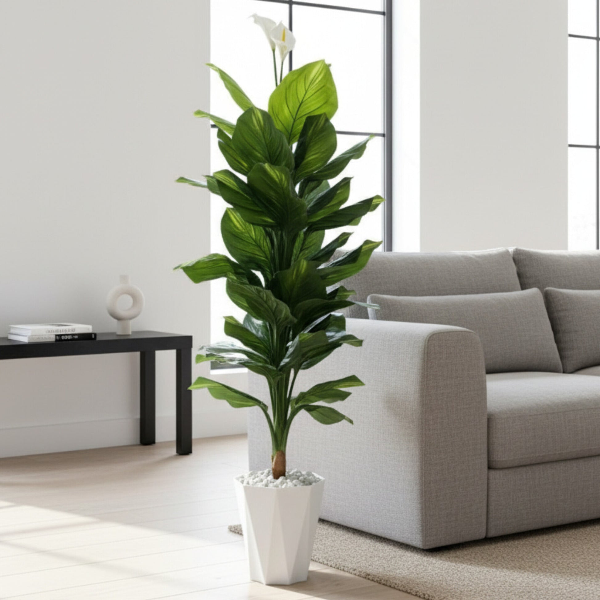 Potted artificial peace lilly plant with vase and pebbles 