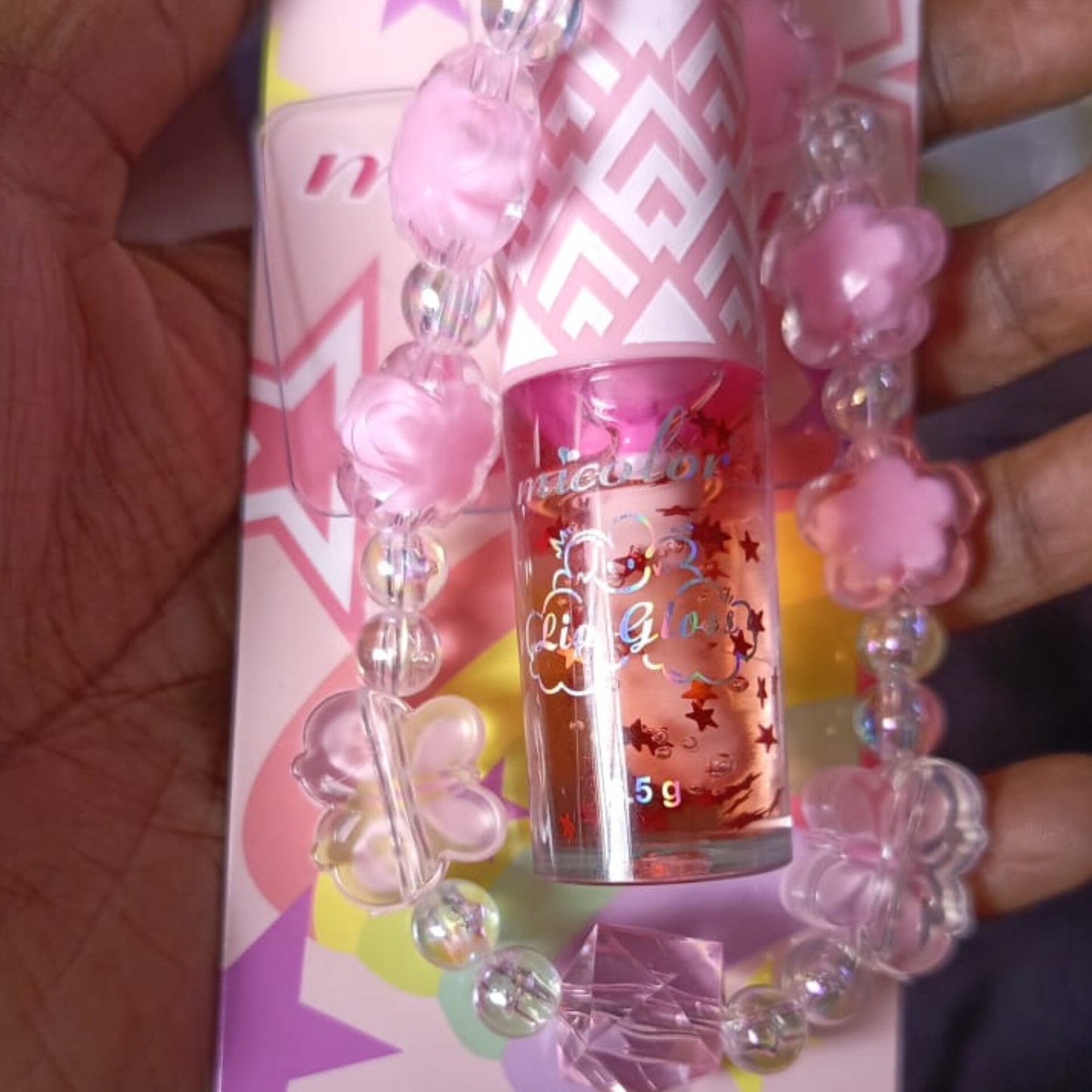 Phone chain with lip gloss