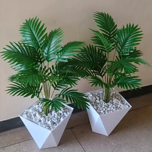 Artificial potted palm tree with vase and pebbles