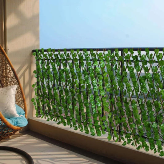 A green artificial leaf privacy screen