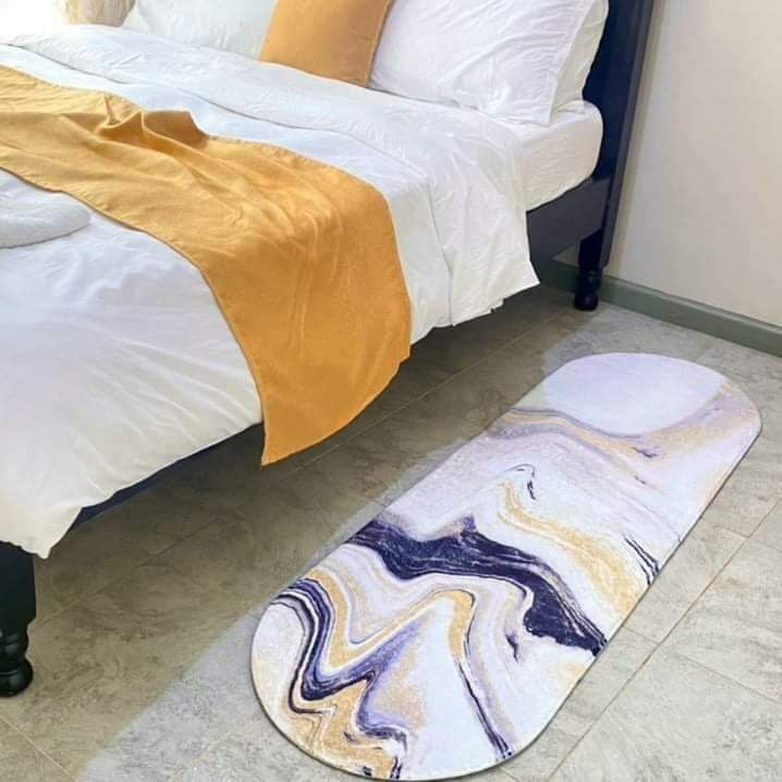 Oval shaped bedside mat