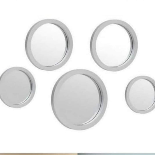 Five white hexagon-shaped mirrors joined together to form a honeycomb cluster.