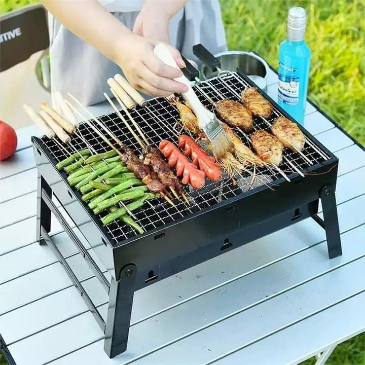 Foldable portable barbeque charcoal grill