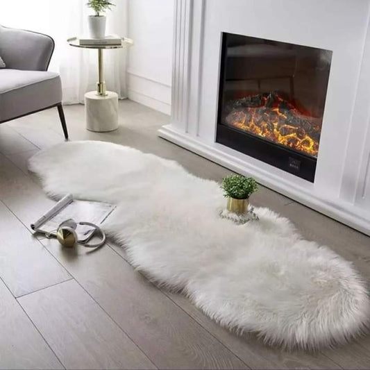 Long white faux fur runner with curved edges.